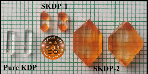 Photograph of pure & SSY doped KDP crystals.