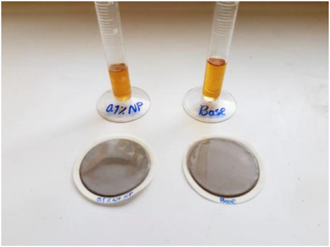 Mud cake and fluid loss after hot rolling test; right to left: a) Base mud. b) 0.1% W/W AMSN.